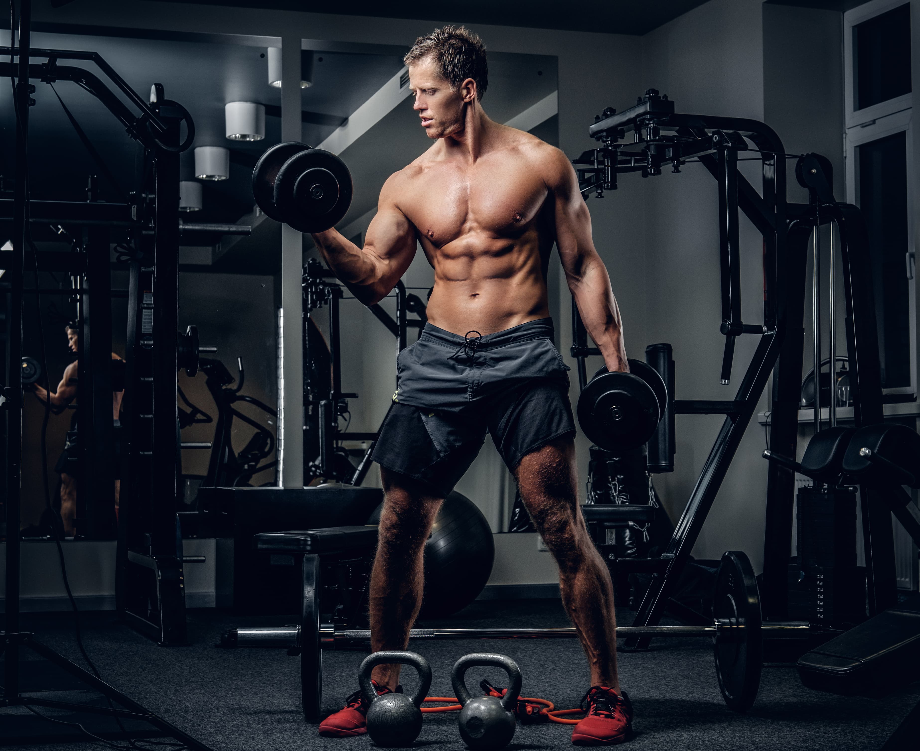 Athlete performing dumbbell workout
